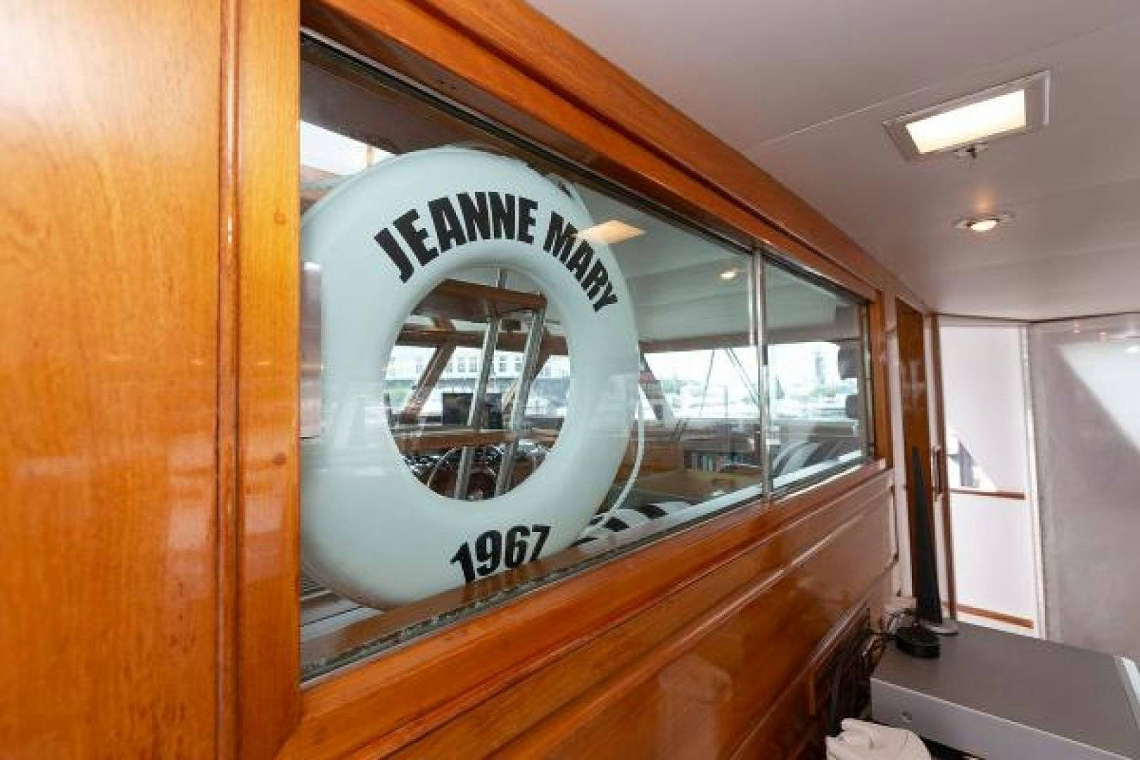 a large wooden cabinet with a sign aboard No Name Yacht for Sale