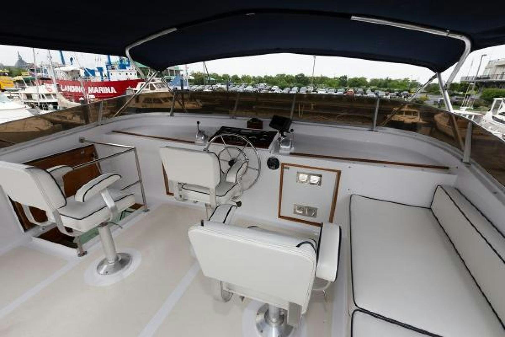 a car with a large windshield aboard No Name Yacht for Sale