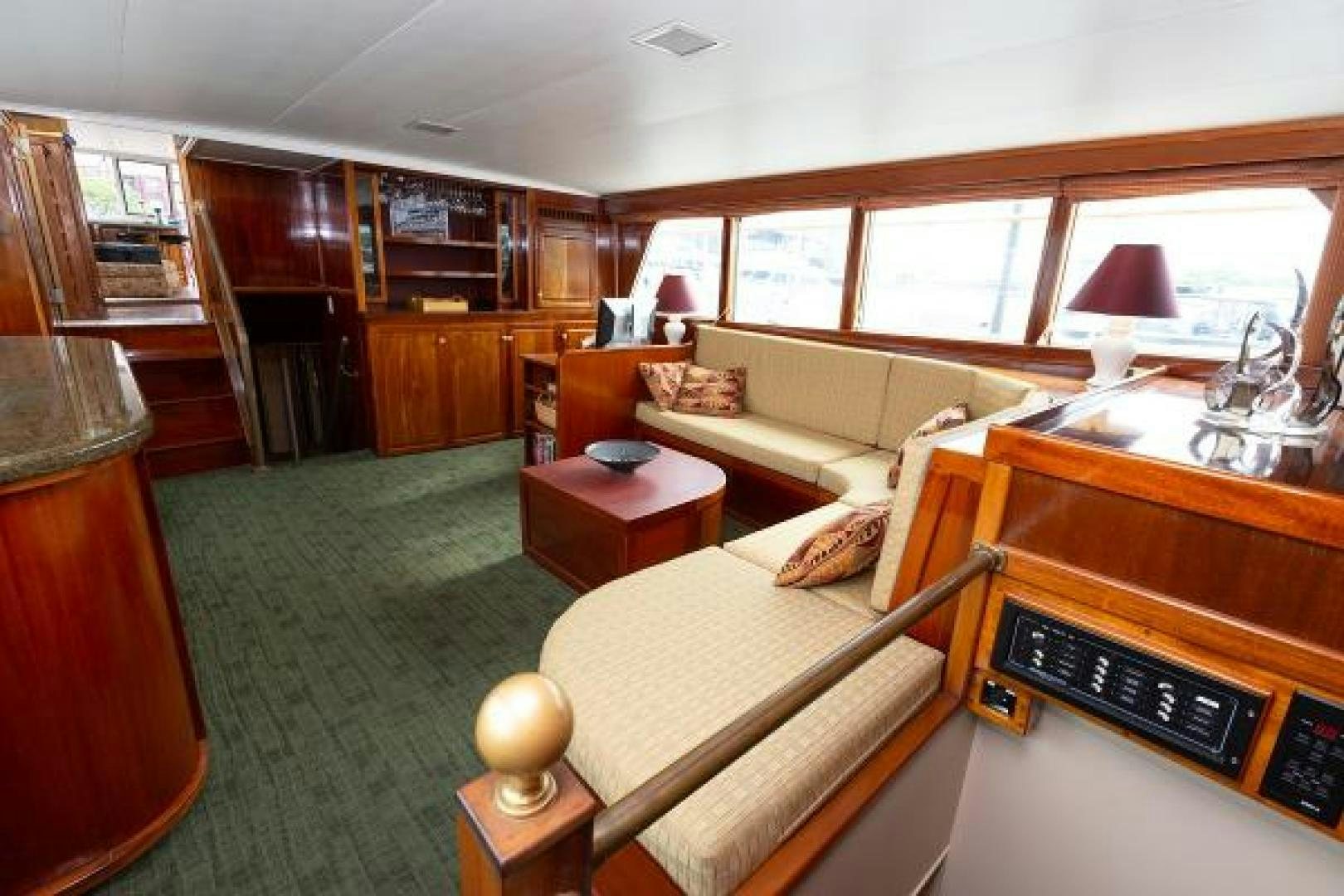 a room with a bed and a piano aboard No Name Yacht for Sale