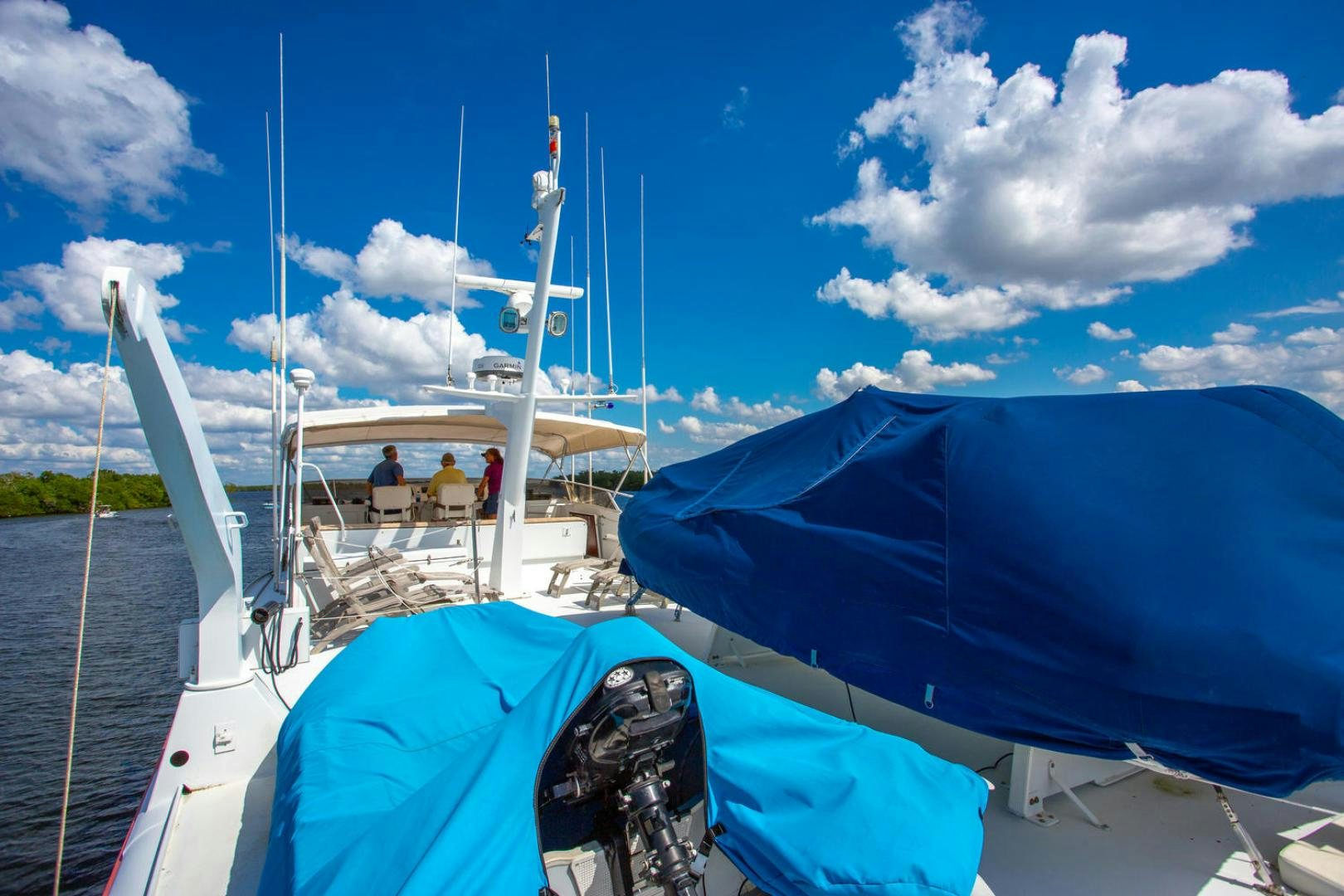 a boat with a blue cover and a blue cover on it aboard HIGH MILEAGE Yacht for Sale