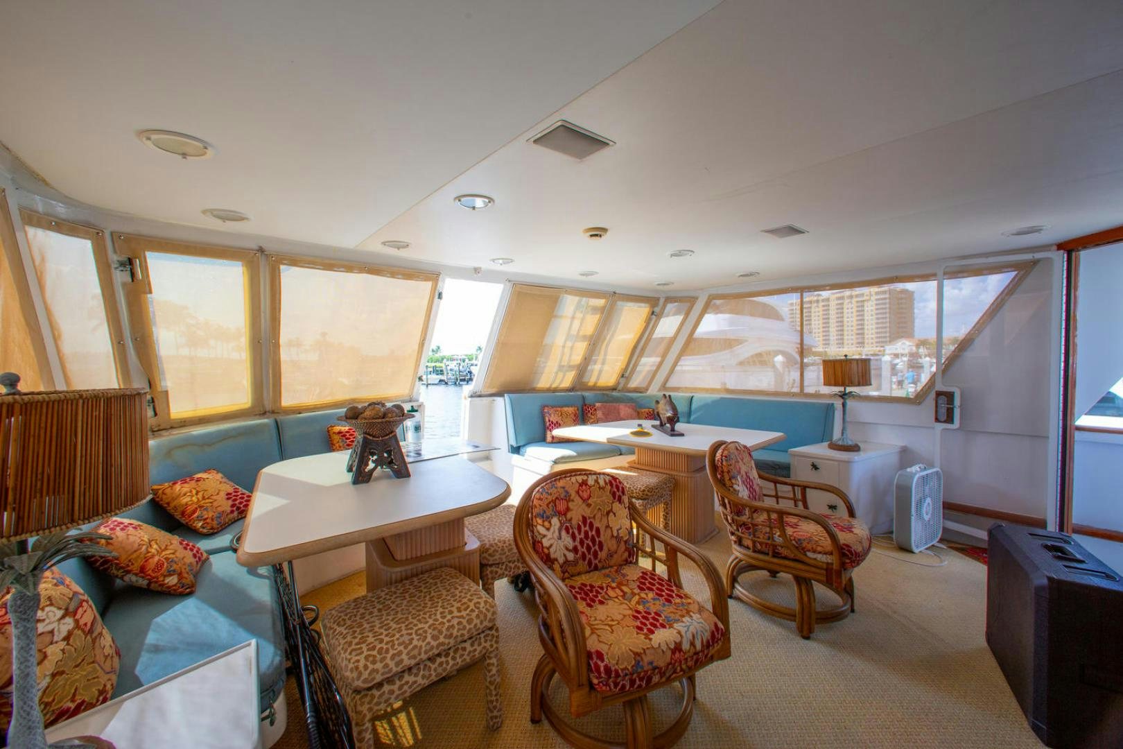 a room with a table chairs and a bed aboard HIGH MILEAGE Yacht for Sale