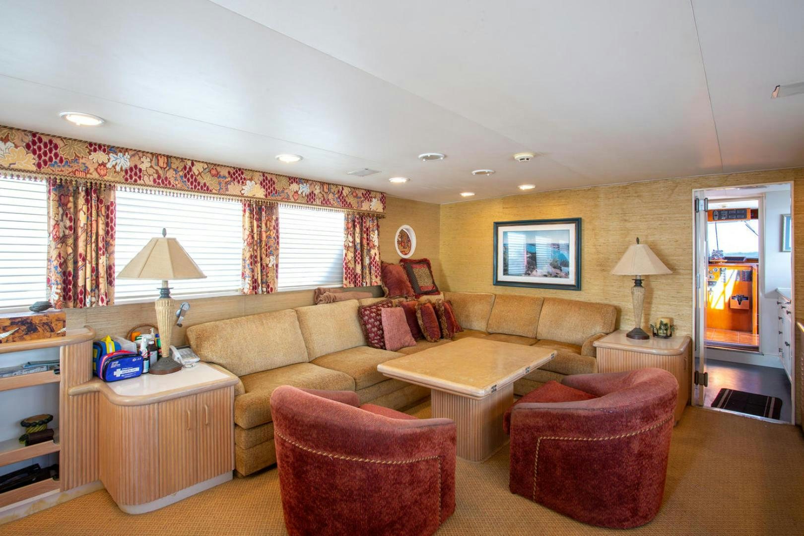 a living room with a couch and a table aboard HIGH MILEAGE Yacht for Sale