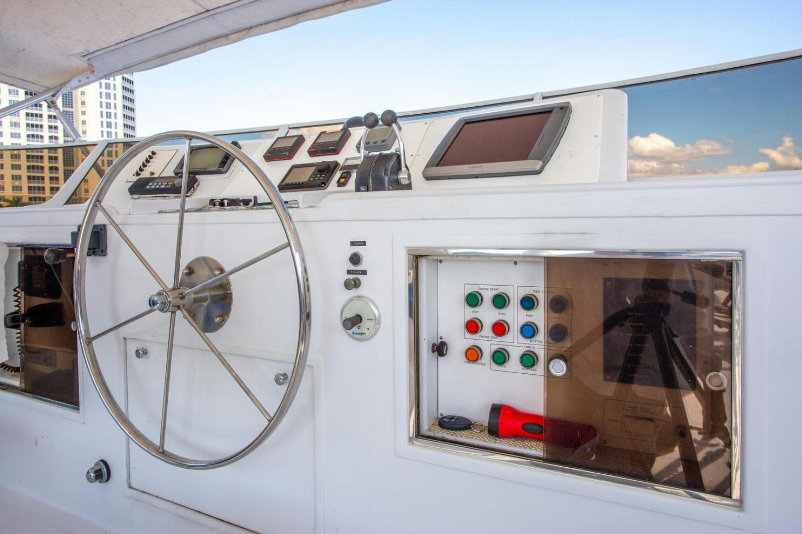 a white vehicle with colorful lights aboard HIGH MILEAGE Yacht for Sale