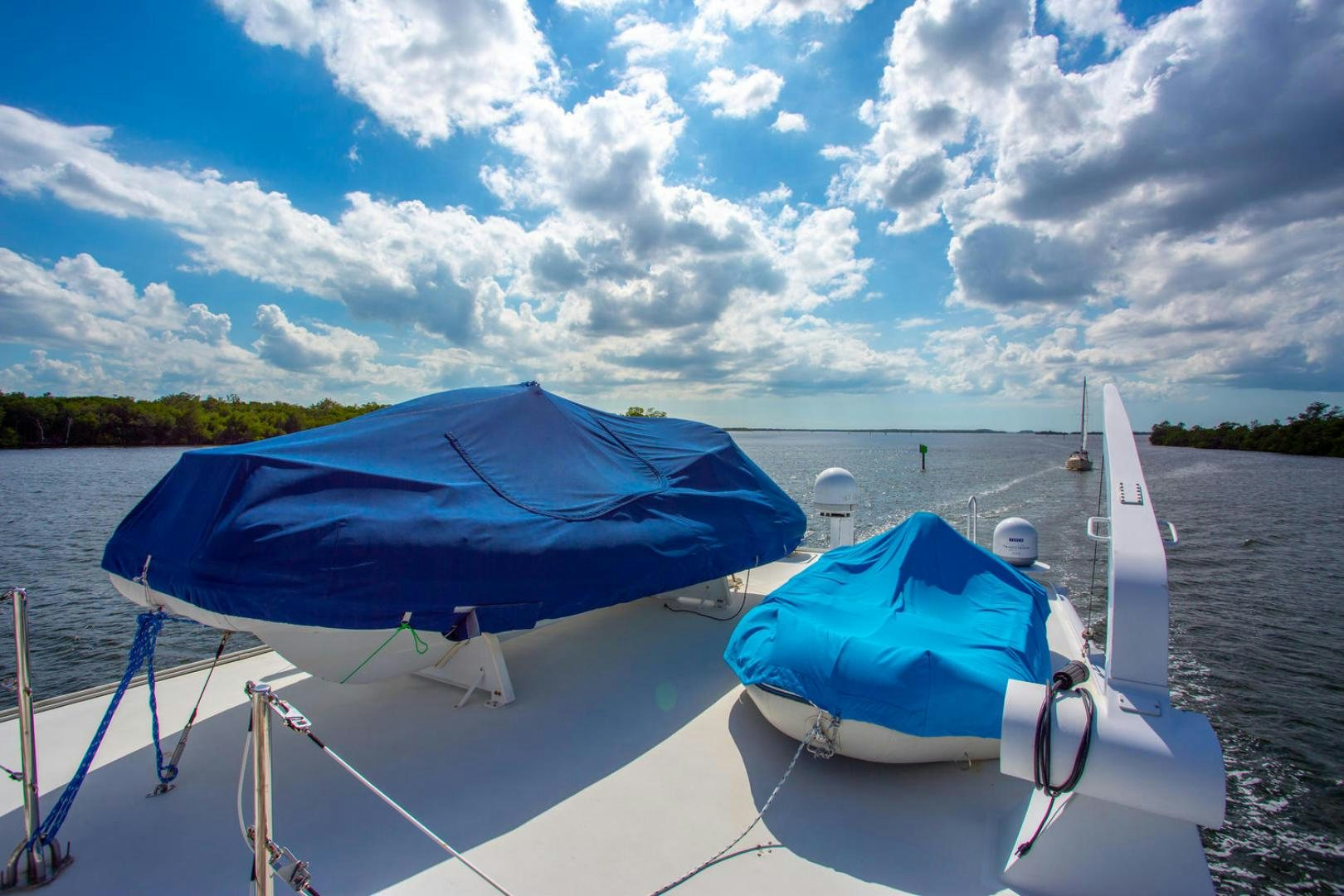 a boat with a blue umbrella on it aboard HIGH MILEAGE Yacht for Sale