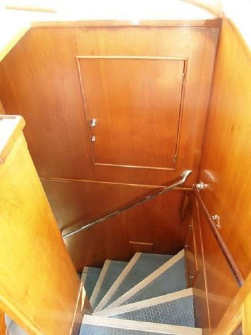 a wooden cabinet with a metal frame aboard HIGH MILEAGE Yacht for Sale