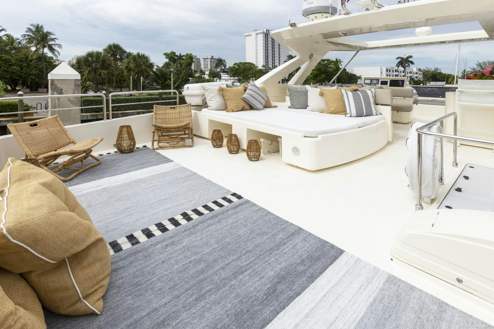 a large white lounge chair on a balcony with a large white building and a large white dome with aboard LA PACE Yacht for Sale