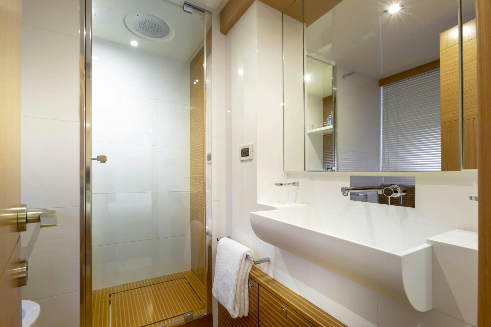 a bathroom with a bathtub and sink aboard LA PACE Yacht for Sale