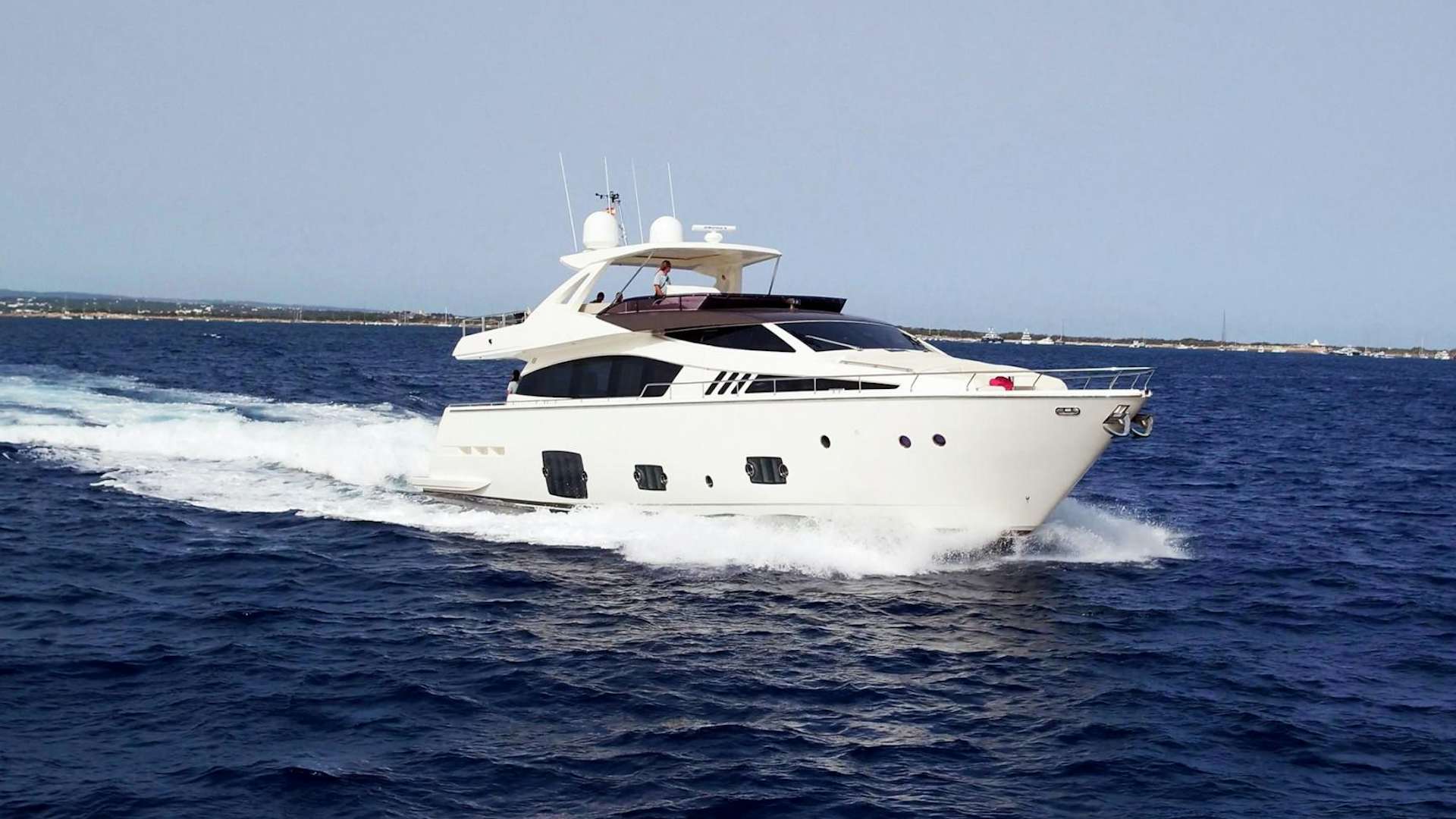 a white yacht on the water aboard LA PACE Yacht for Sale