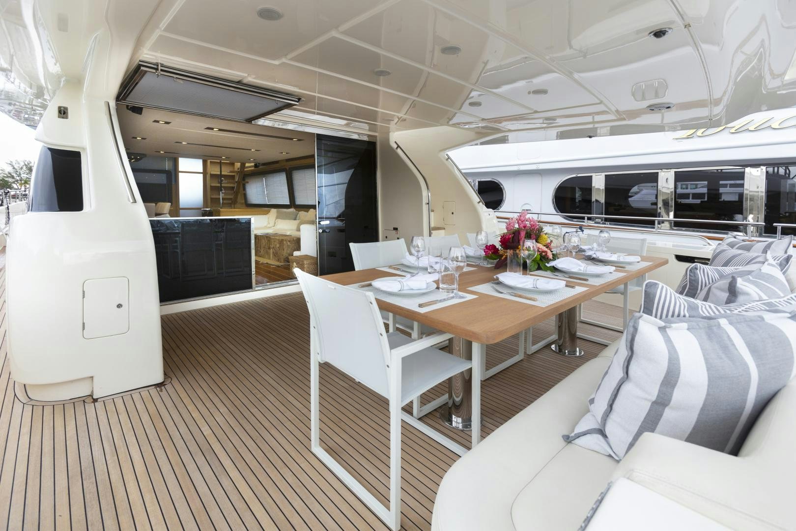 a room with a table and chairs aboard LA PACE Yacht for Sale
