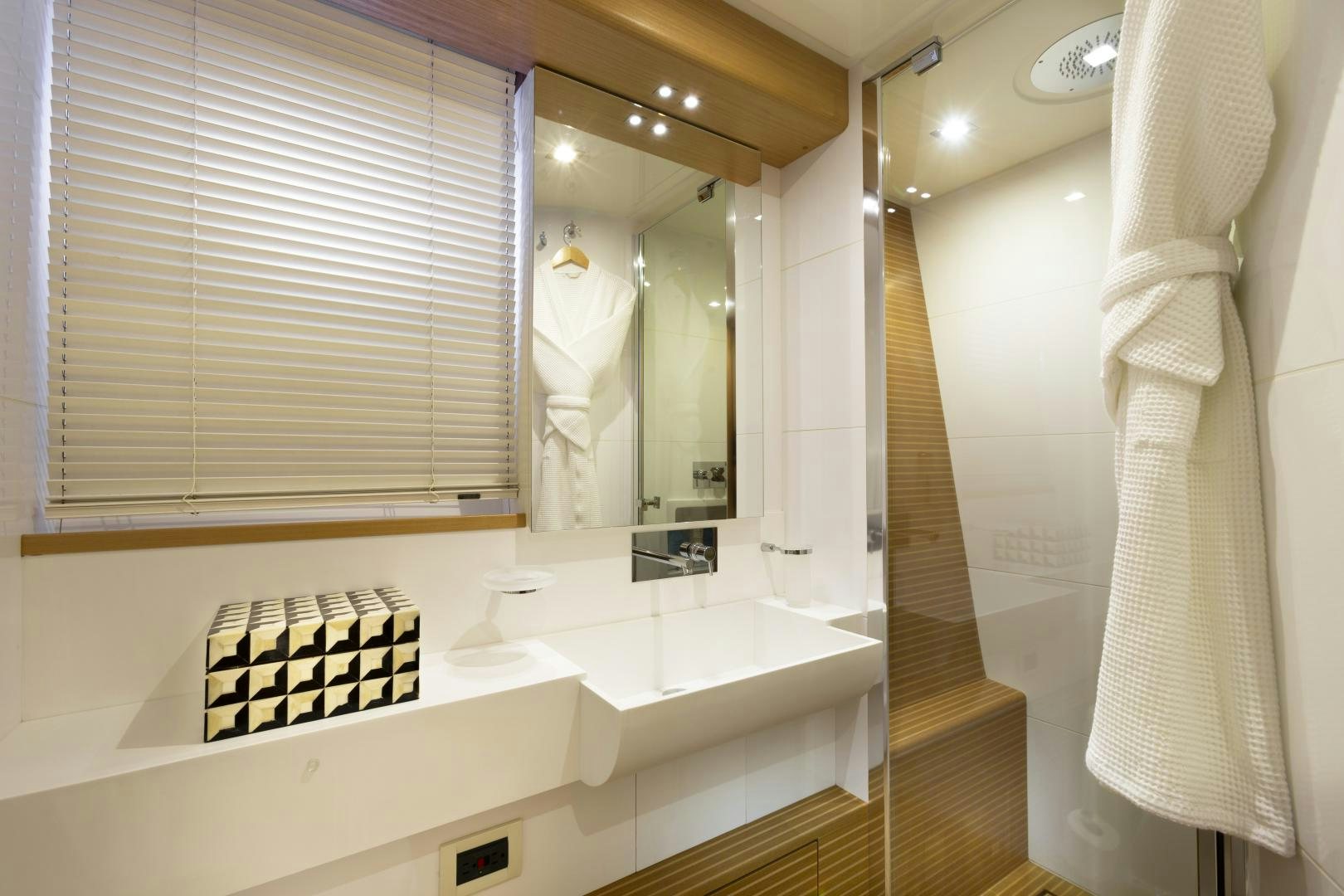 a bathroom with a large mirror aboard LA PACE Yacht for Sale