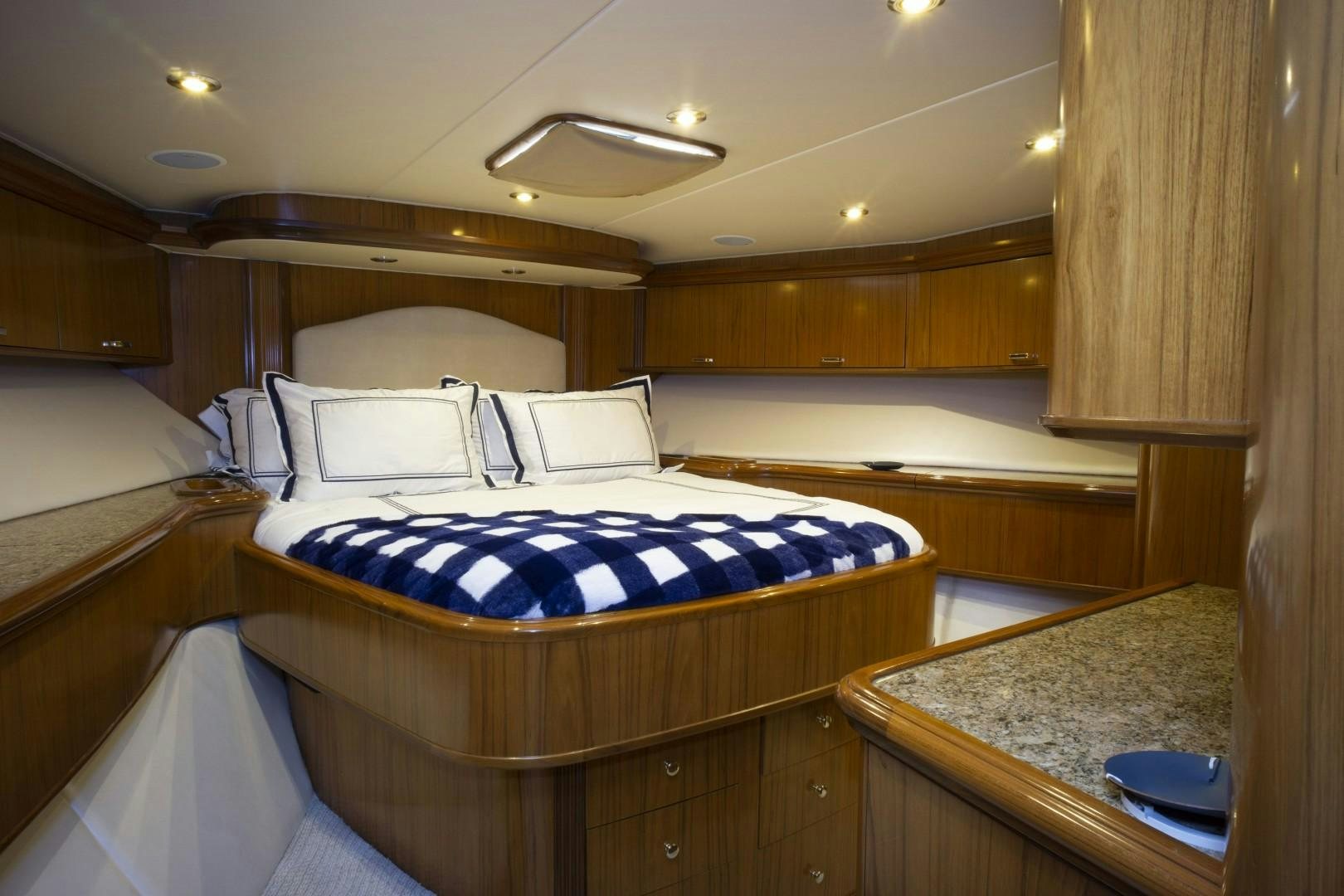 a room with a bed and a sink aboard REEL DEAL Yacht for Sale