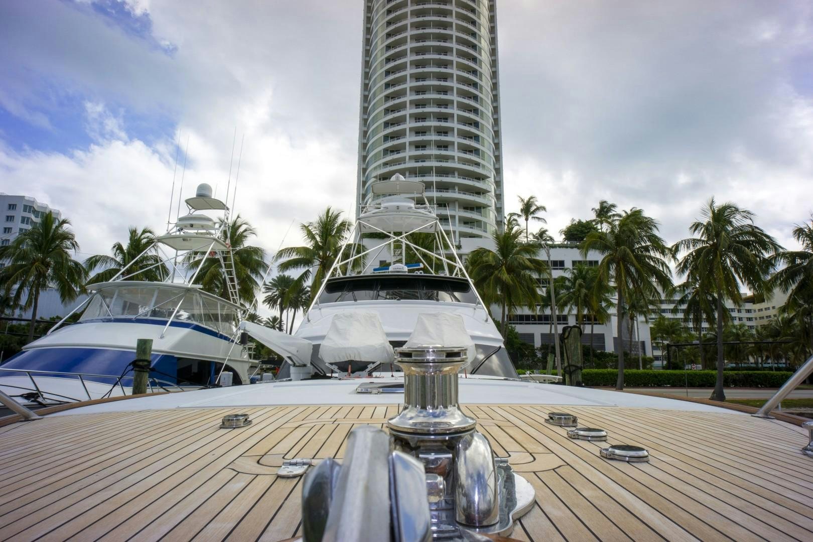 a pool with a building in the background aboard REEL DEAL Yacht for Sale