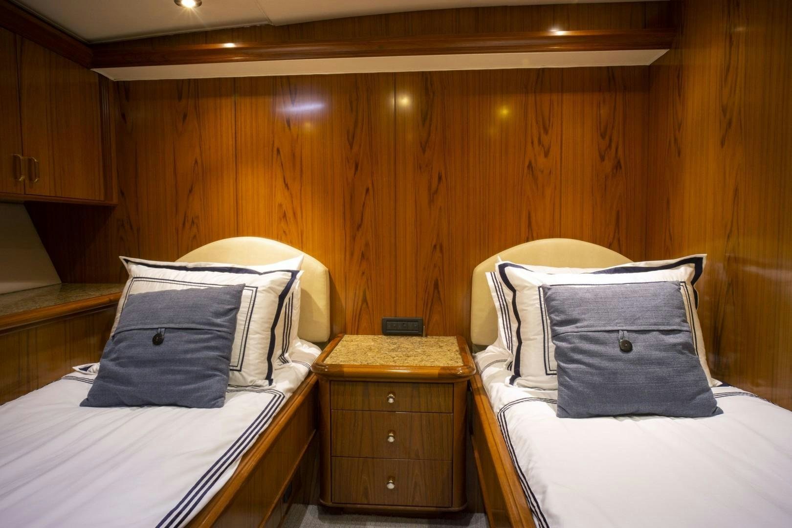 a couple of beds in a room aboard REEL DEAL Yacht for Sale