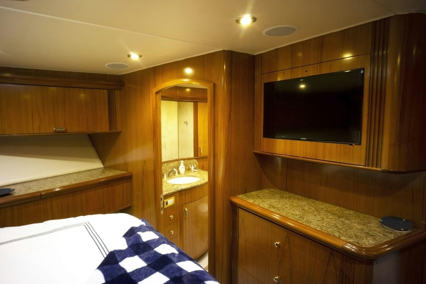 a bathroom with a mirror and a sink aboard REEL DEAL Yacht for Sale