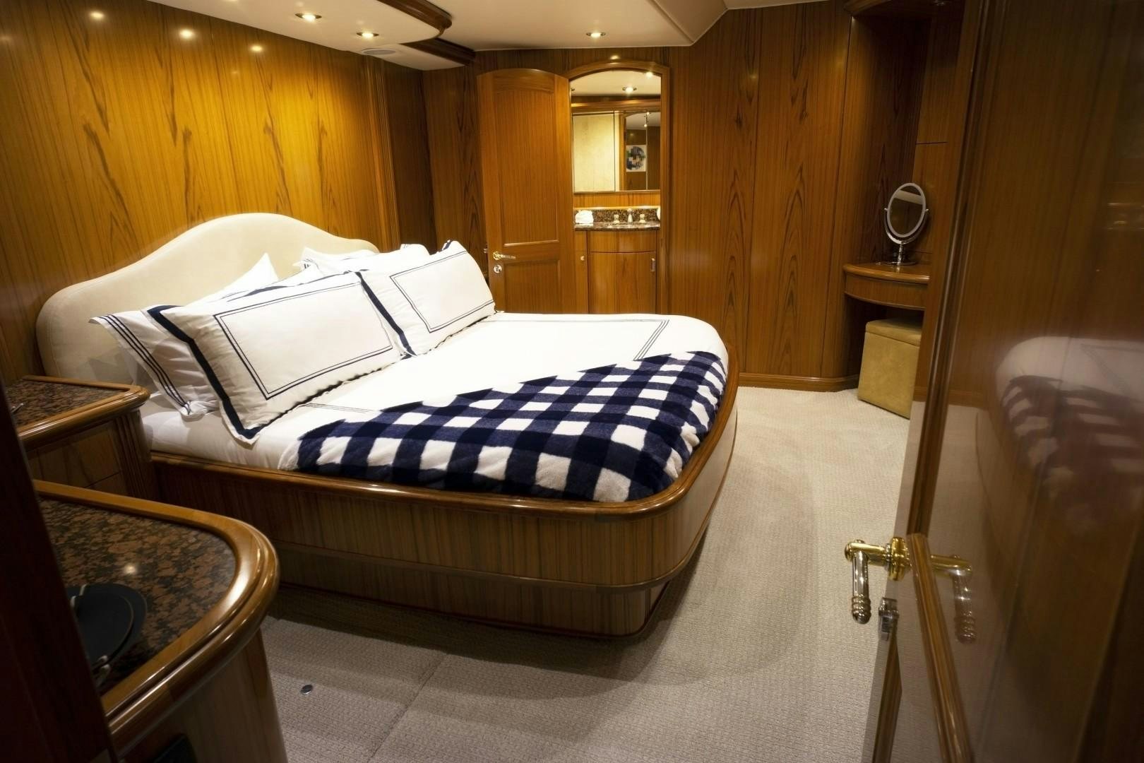 a bed in a room aboard REEL DEAL Yacht for Sale