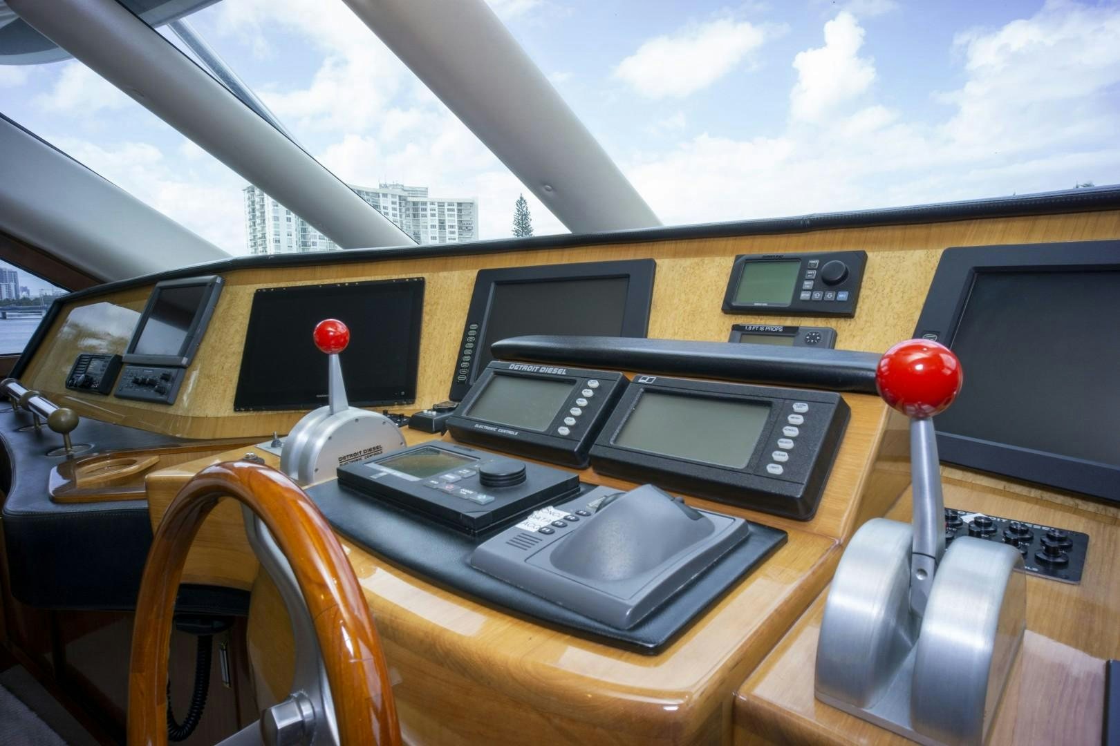 inside of a yellow car aboard REEL DEAL Yacht for Sale