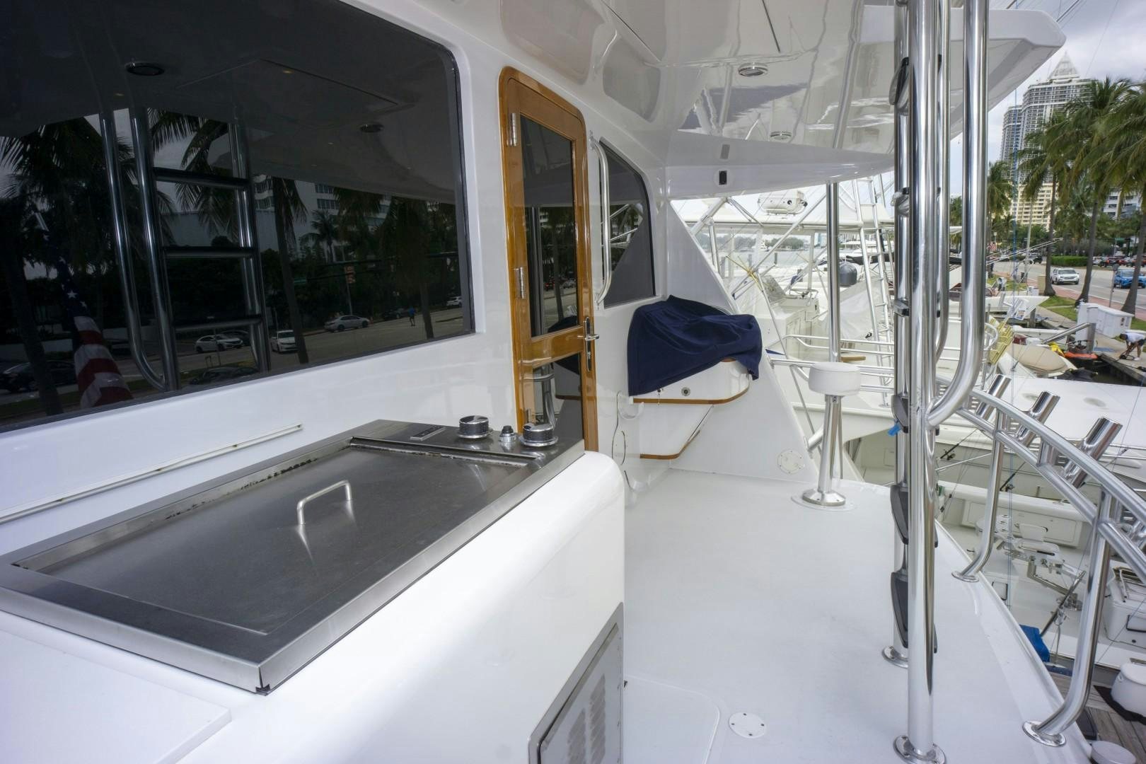 a white room with a sink and a chair aboard REEL DEAL Yacht for Sale