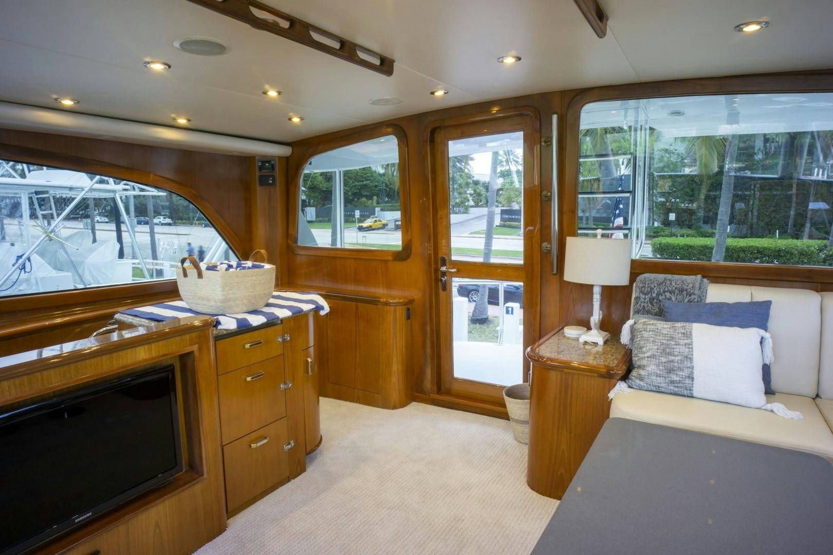 a bedroom with a large bed and a tv aboard REEL DEAL Yacht for Sale