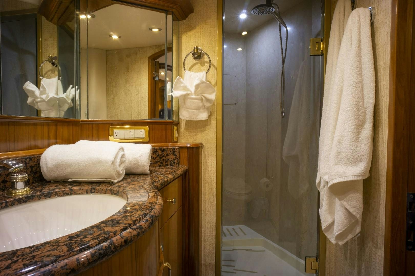 a bathroom with a sink and a mirror aboard REEL DEAL Yacht for Sale