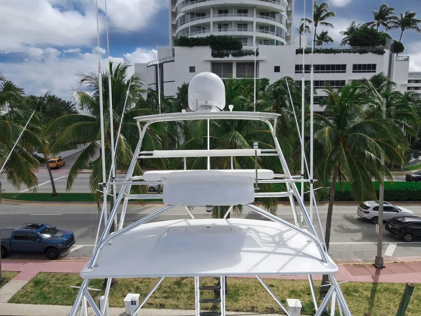 a white chair on a balcony aboard REEL DEAL Yacht for Sale
