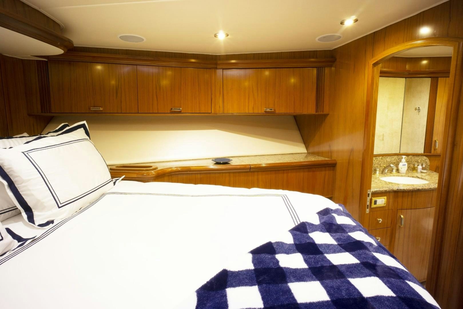 a bed in a room aboard REEL DEAL Yacht for Sale