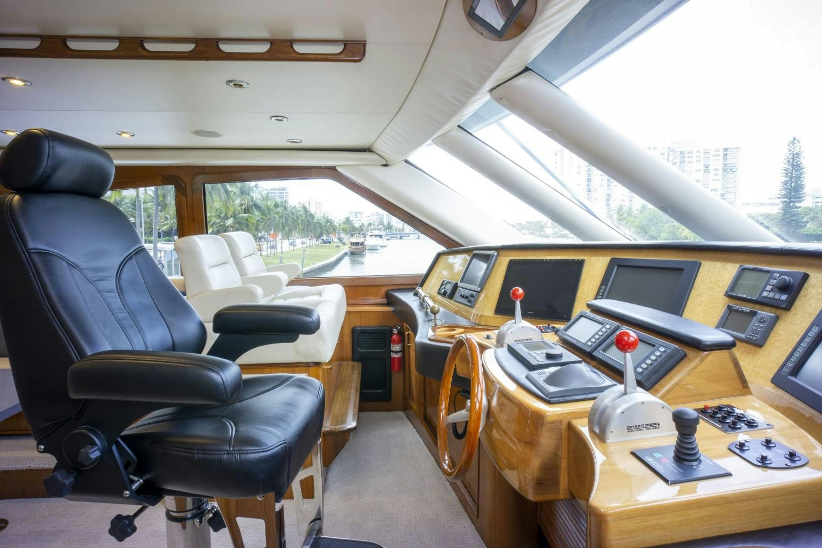 inside of a vehicle with a desk and chairs and a window aboard REEL DEAL Yacht for Sale