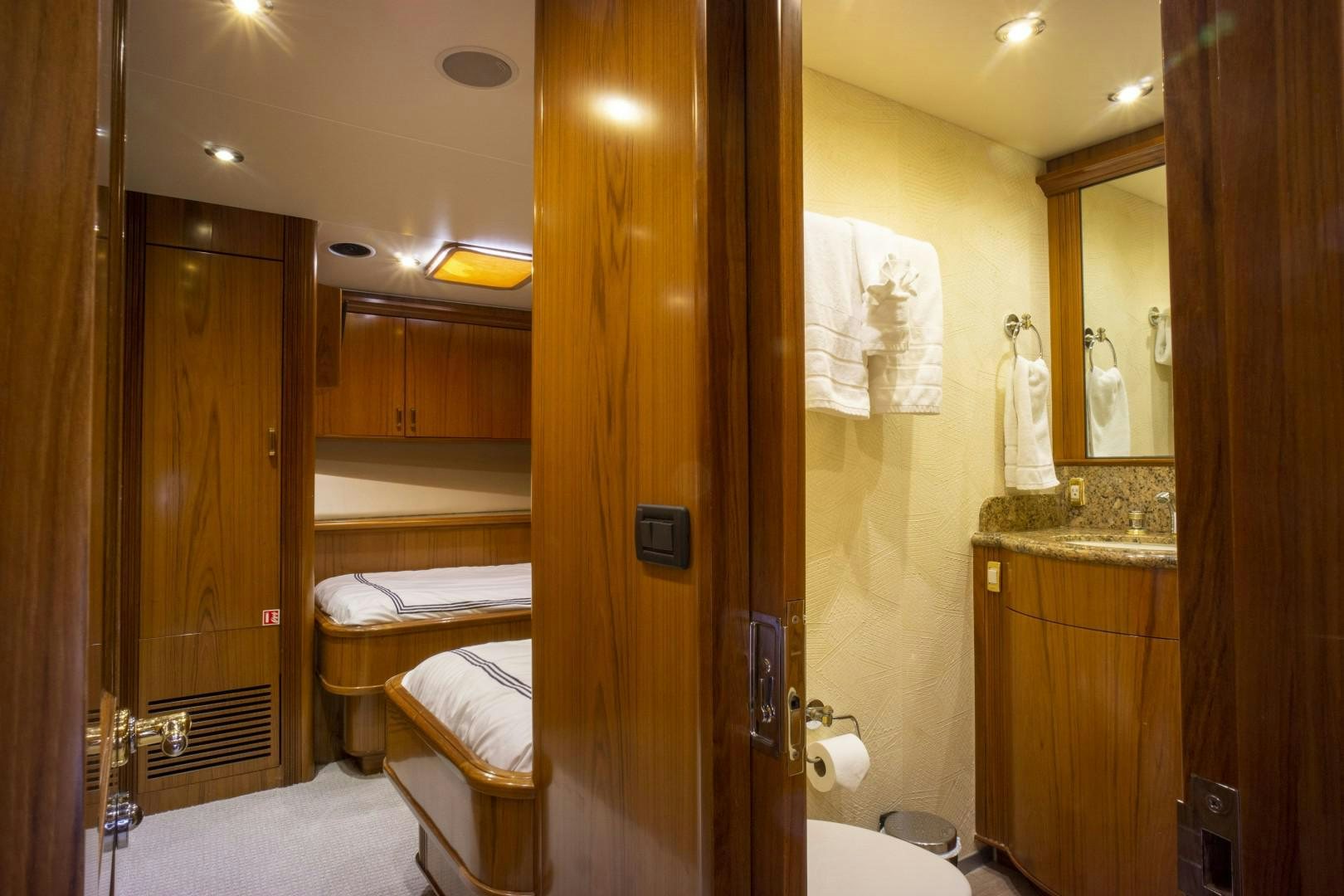 a bathroom with a large mirror aboard REEL DEAL Yacht for Sale