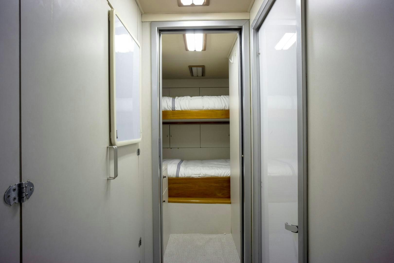 a closet with a bed aboard REEL DEAL Yacht for Sale