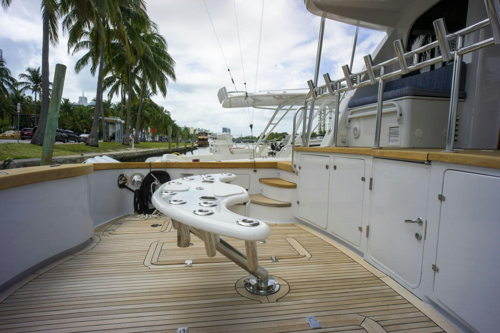 a large white machine on a wooden deck aboard REEL DEAL Yacht for Sale