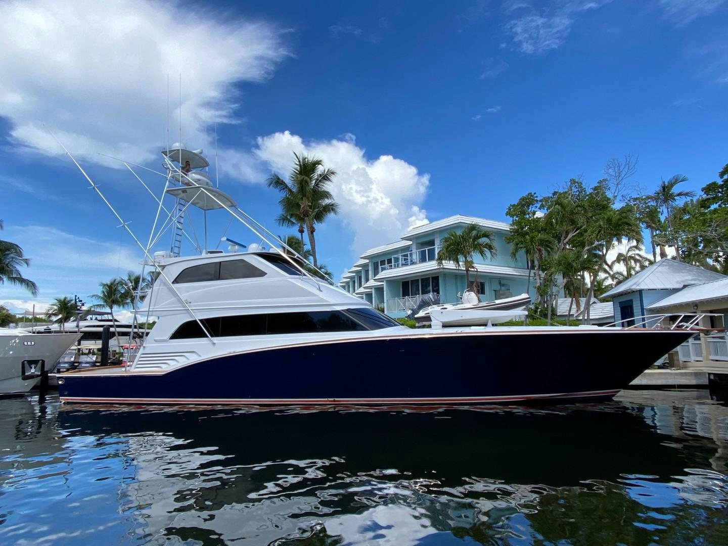 a boat docked at a pier aboard REEL DEAL Yacht for Sale