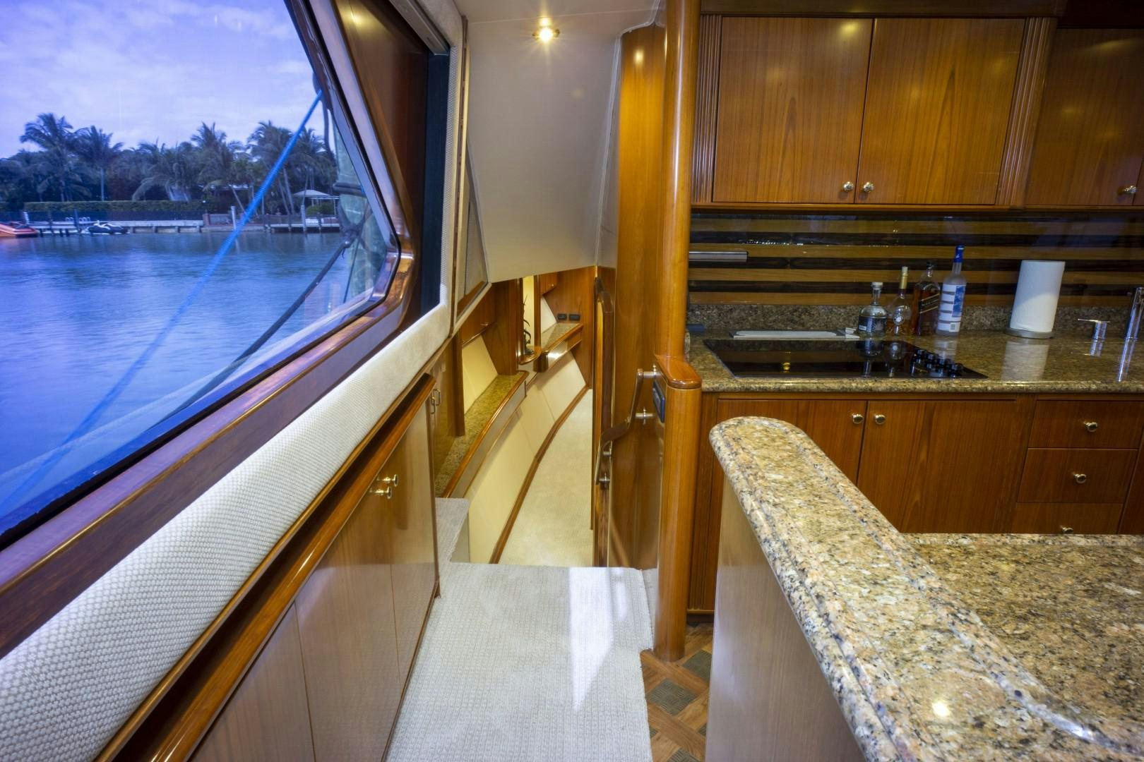 a kitchen with a sink and a large window aboard REEL DEAL Yacht for Sale