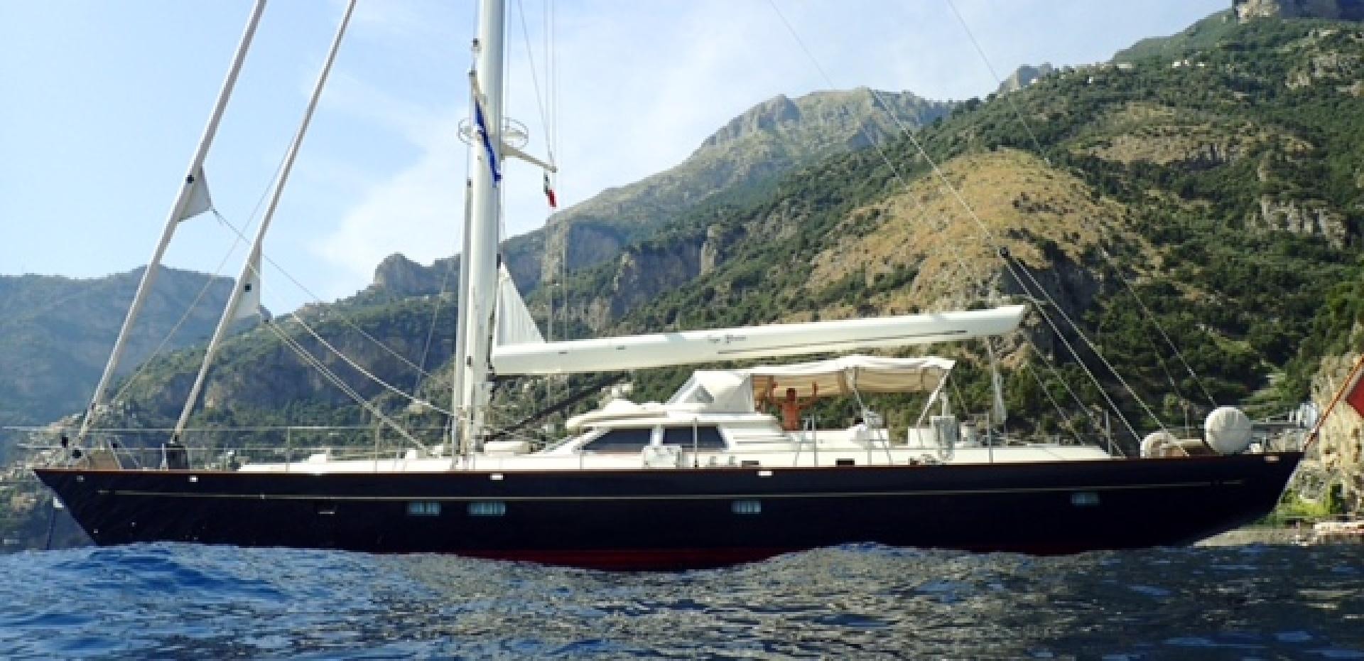 a boat on the water aboard TIGA BELAS Yacht for Sale