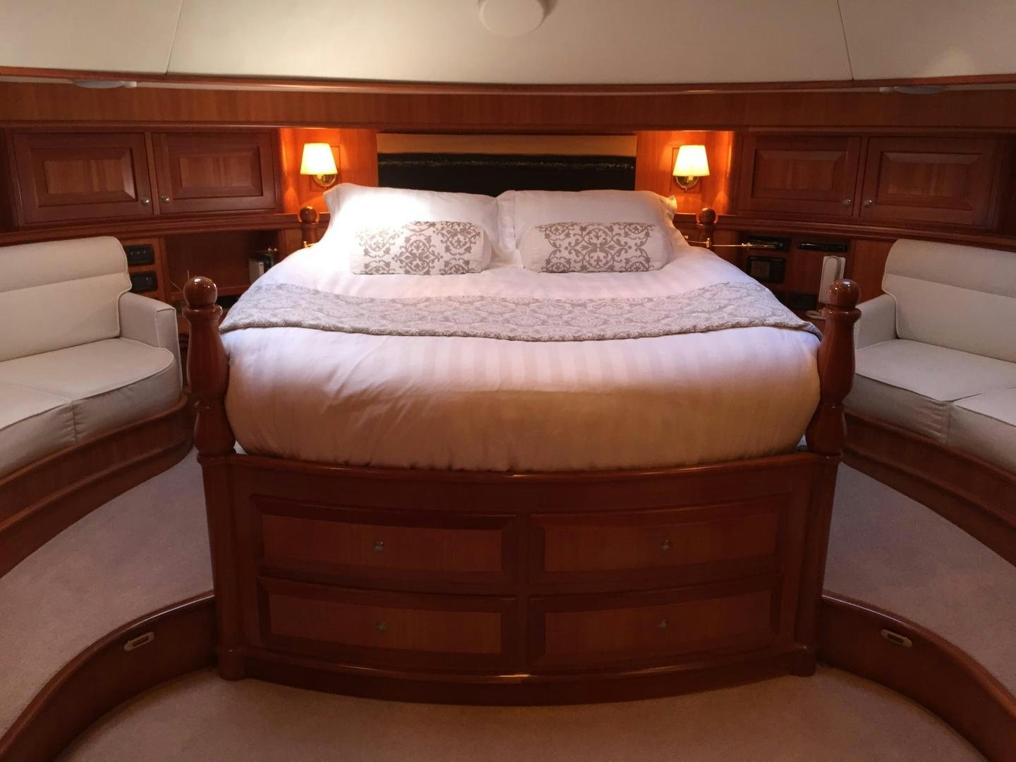 a bed with a white pillow aboard TIGA BELAS Yacht for Sale