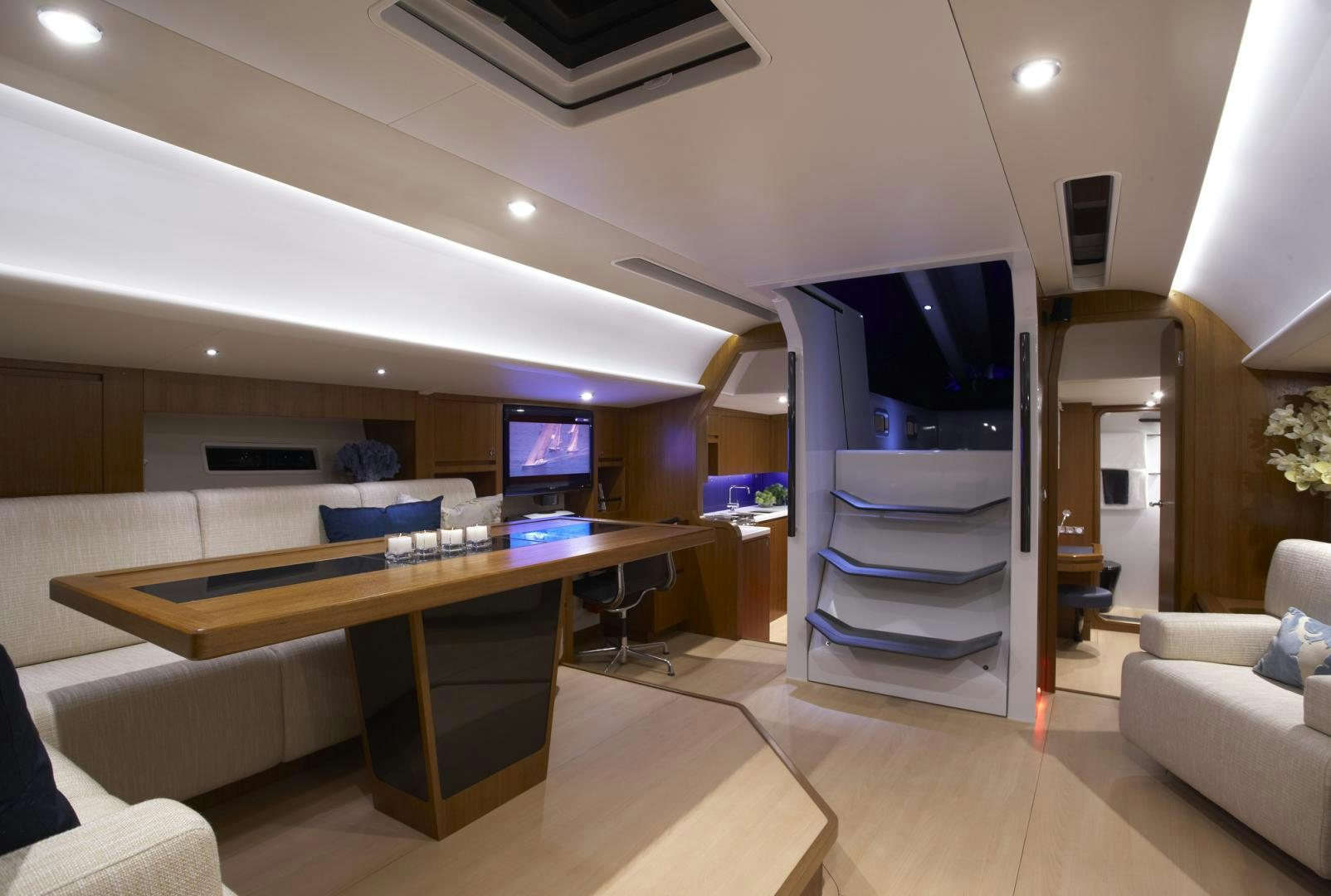 a room with a table and tv aboard SINGULARITY Yacht for Sale