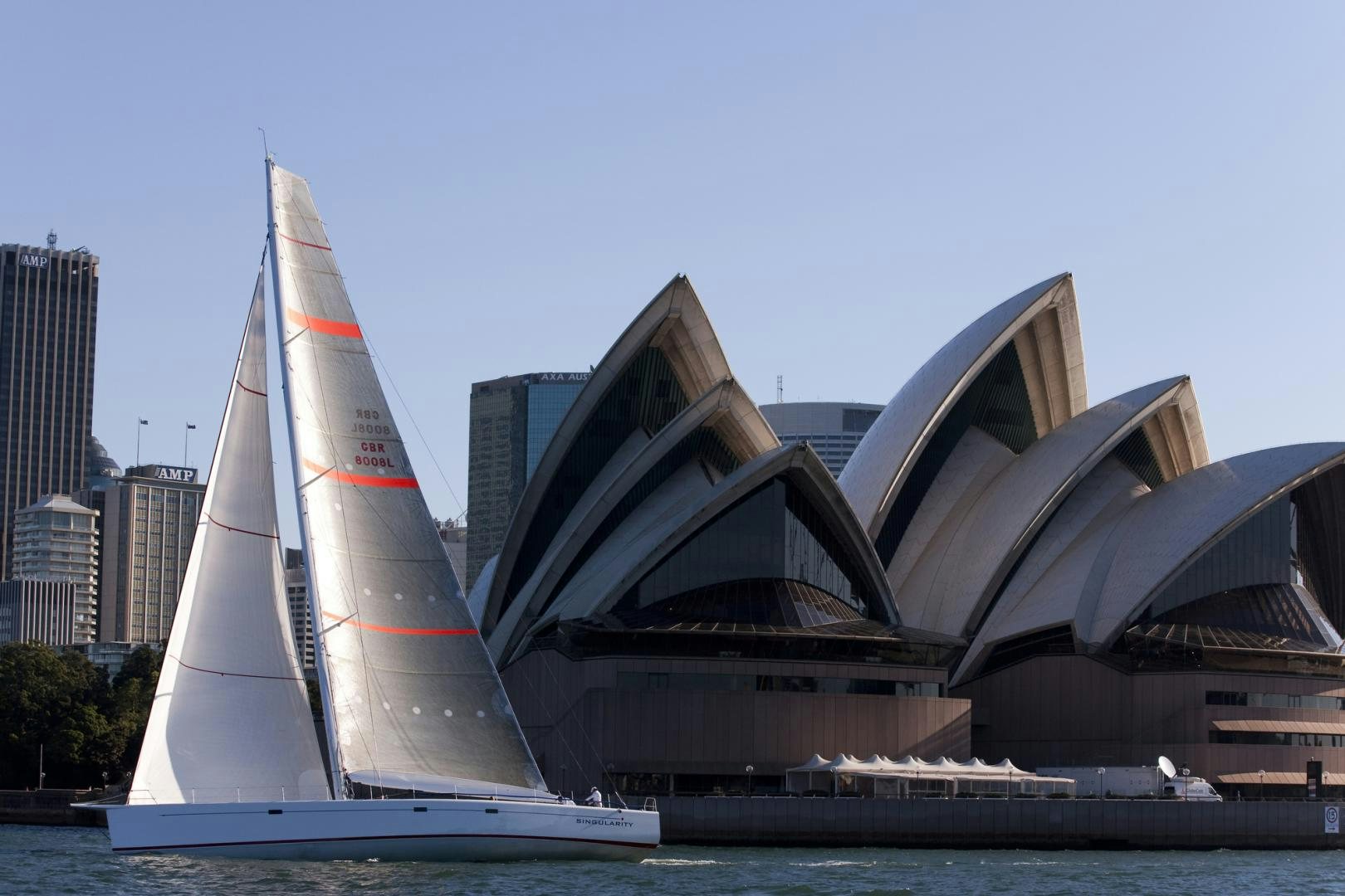 sailboat in front of a building aboard SINGULARITY Yacht for Sale