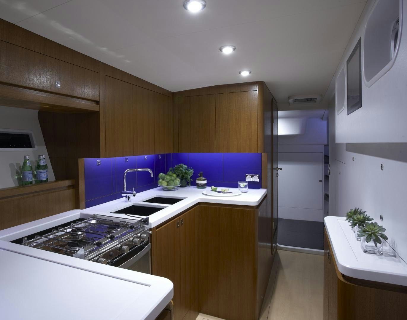 a kitchen with a stove and sink aboard SINGULARITY Yacht for Sale