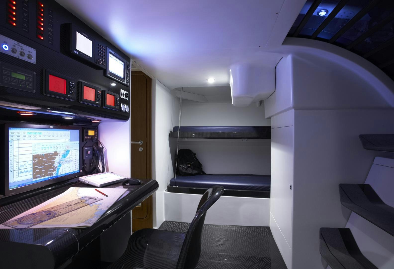 a room with a desk and computer aboard SINGULARITY Yacht for Sale