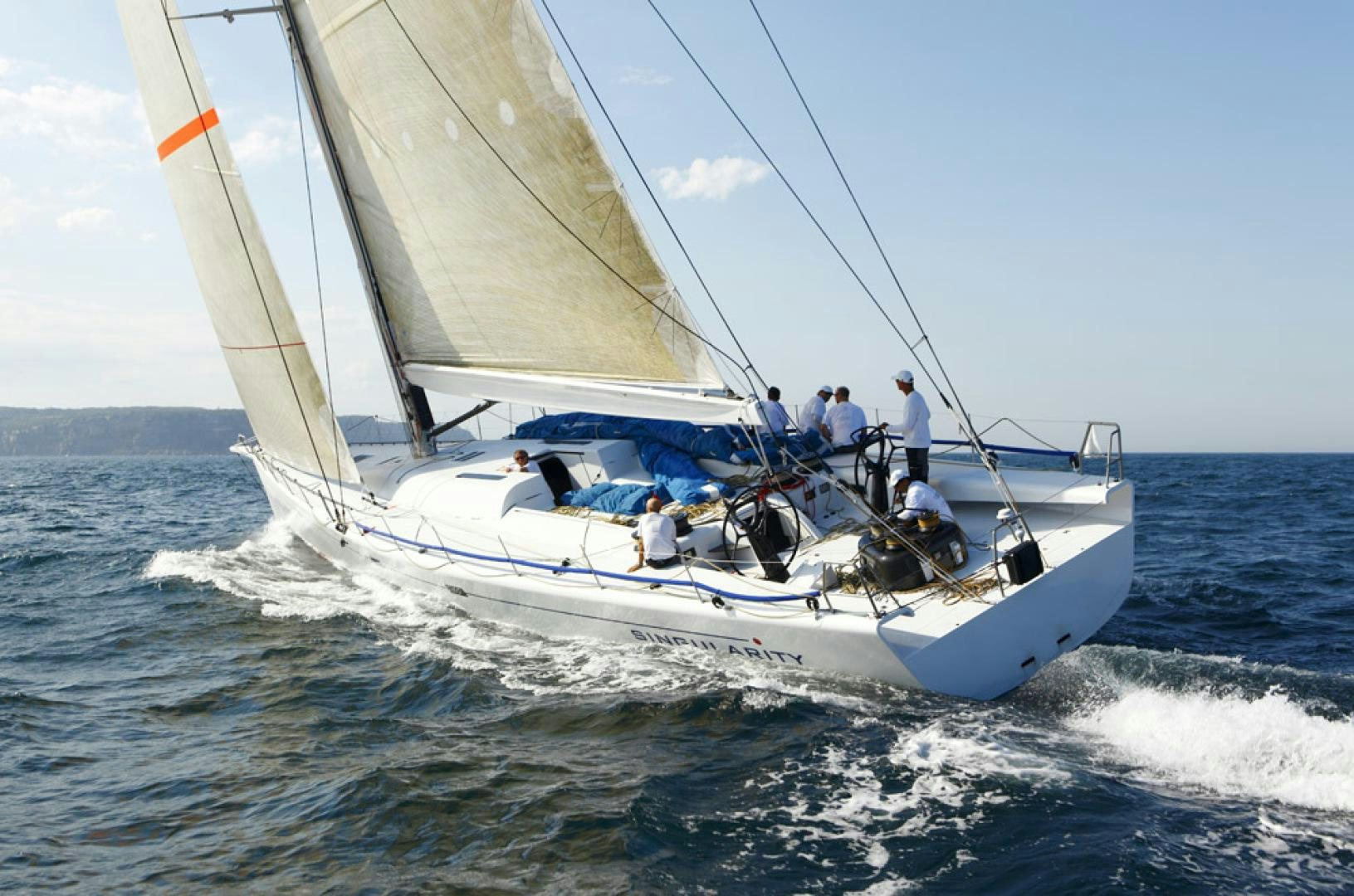 a group of people on a sailboat aboard SINGULARITY Yacht for Sale