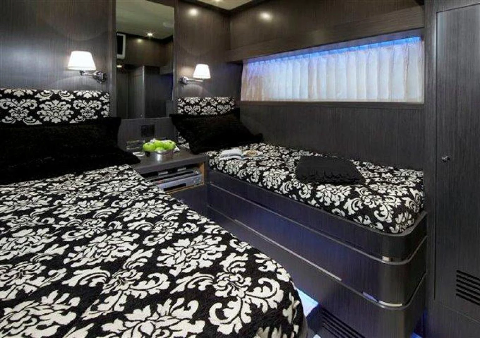 a room with two beds aboard JOHNSON 80 SKYLOUNGE Yacht for Sale