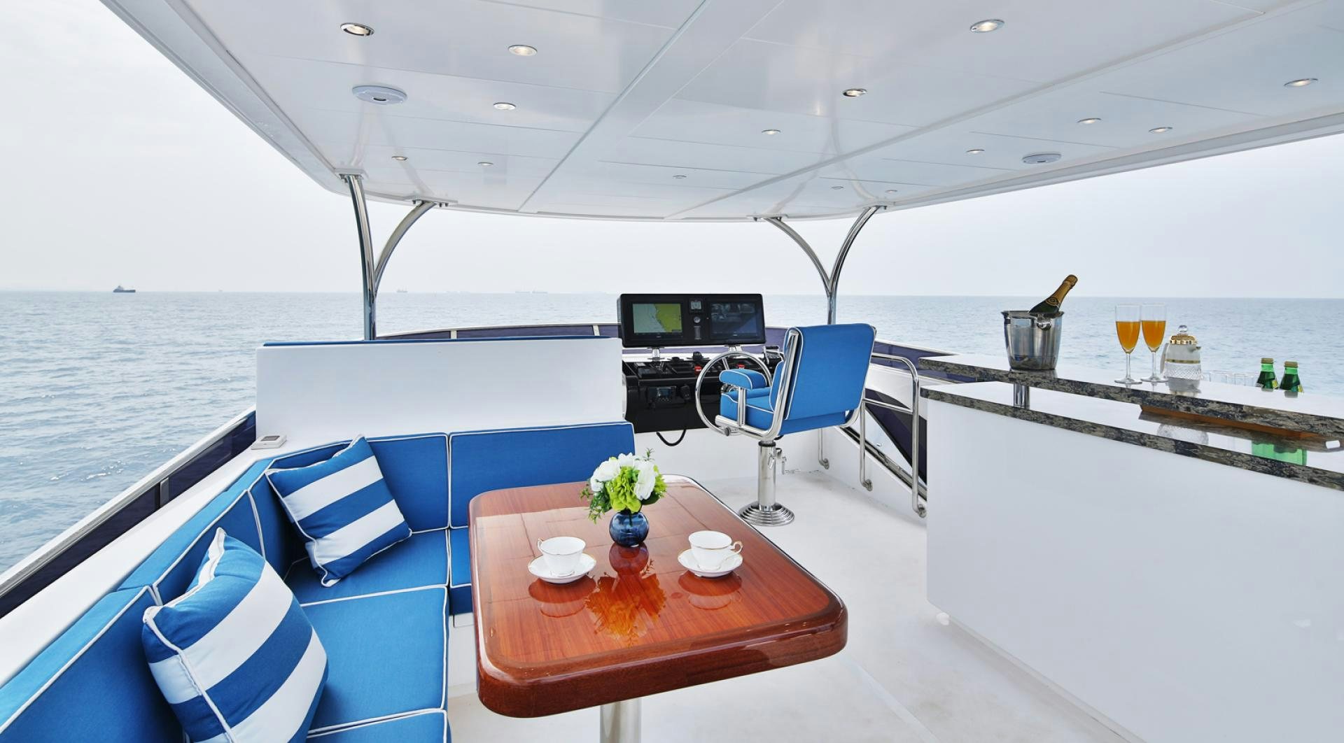 a boat with a table and chairs aboard No Name Yacht for Sale