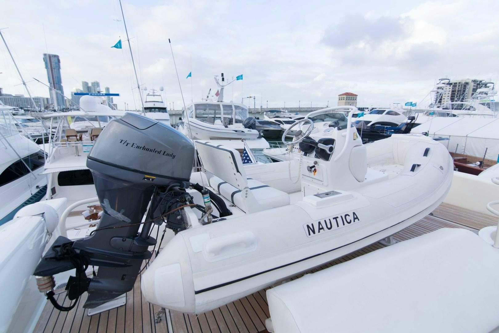 a boat with a motor attached to it aboard ENCHANTED LADY Yacht for Sale