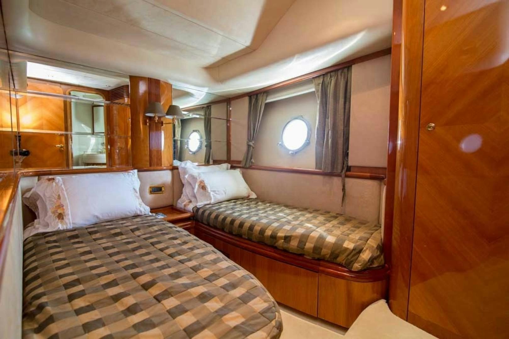 a couple of beds in a room aboard ENCHANTED LADY Yacht for Sale