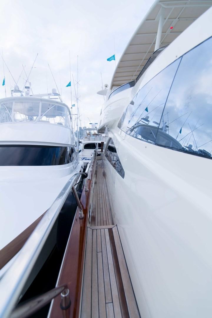 a group of boats are parked in a harbor aboard ENCHANTED LADY Yacht for Sale