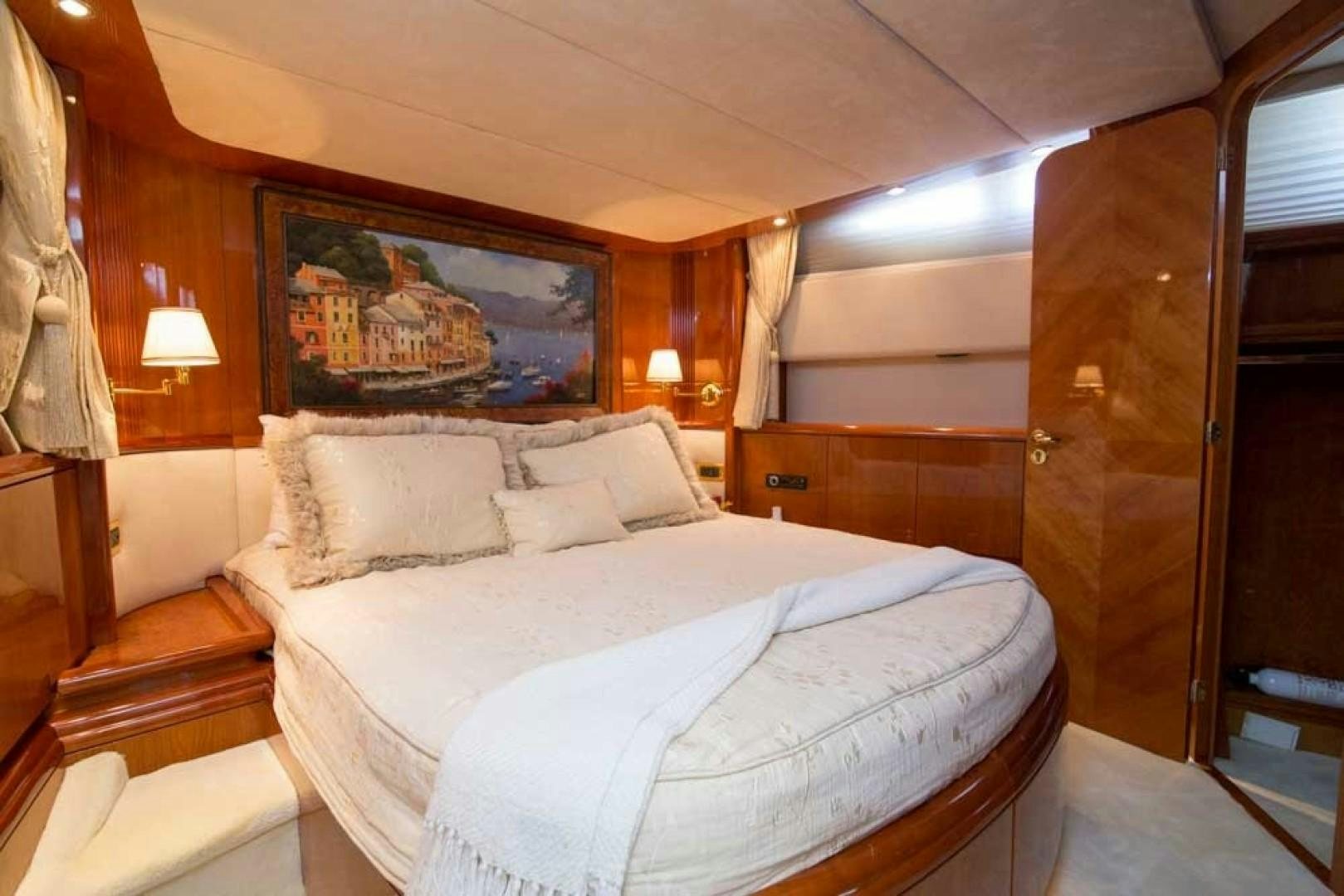 a bed in a room aboard ENCHANTED LADY Yacht for Sale