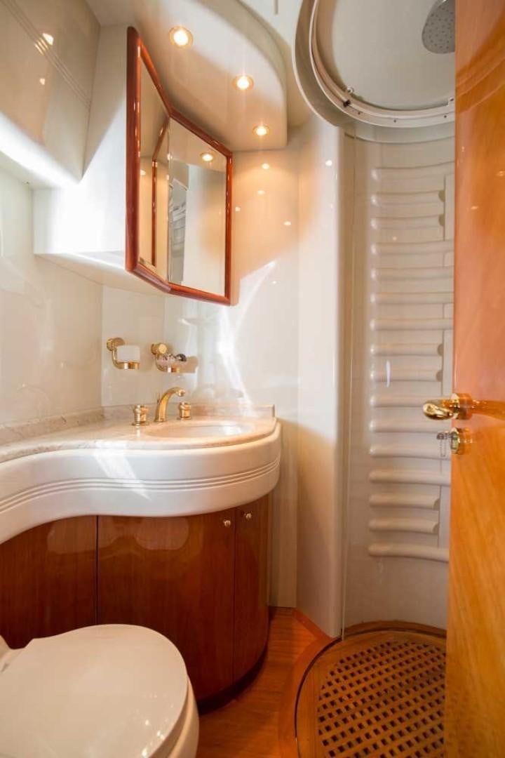 a bathroom with a sink and toilet aboard ENCHANTED LADY Yacht for Sale