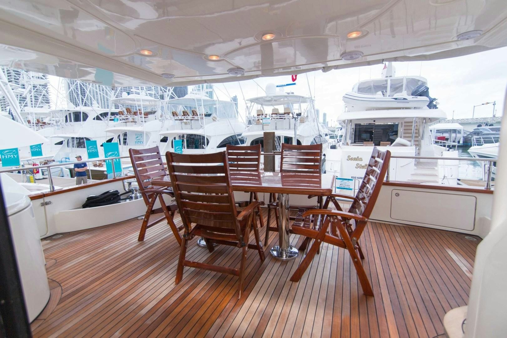a restaurant with tables and chairs aboard ENCHANTED LADY Yacht for Sale