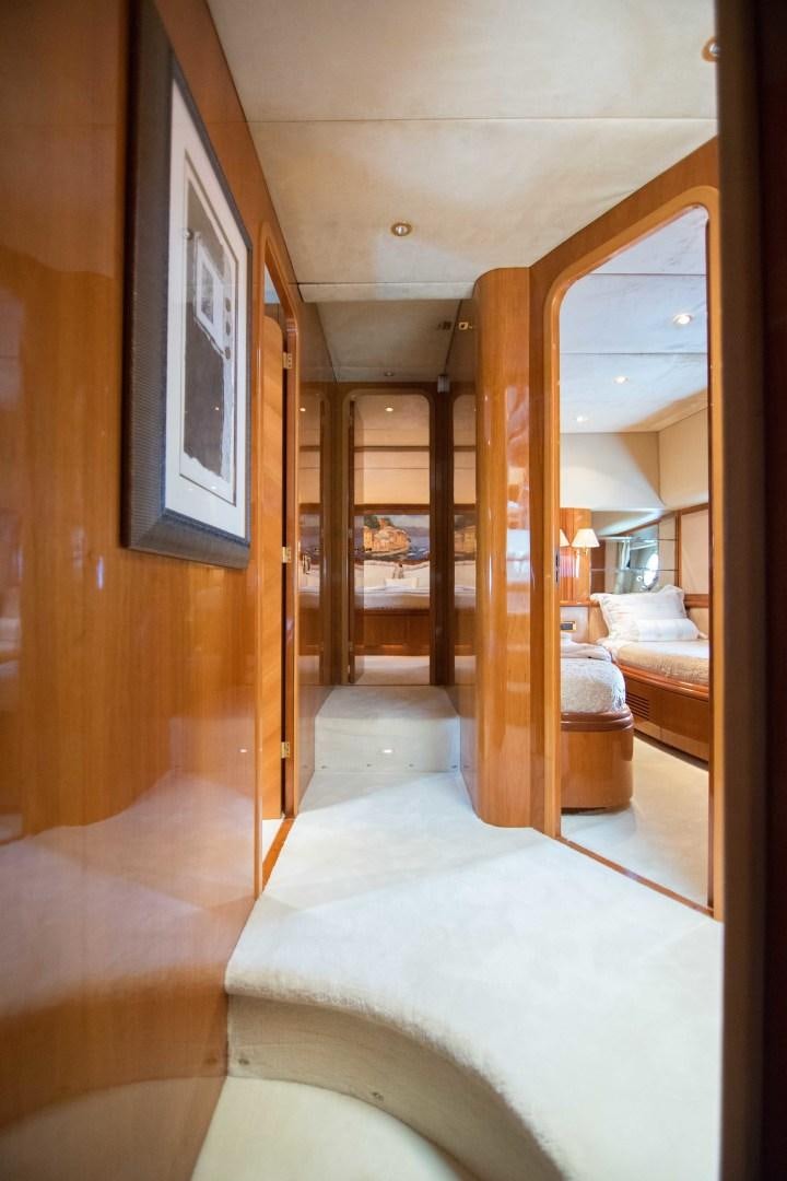 a room with a bed and a mirror aboard ENCHANTED LADY Yacht for Sale