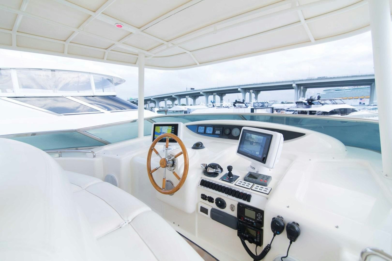 inside of a white room with many electronics and a large window aboard ENCHANTED LADY Yacht for Sale