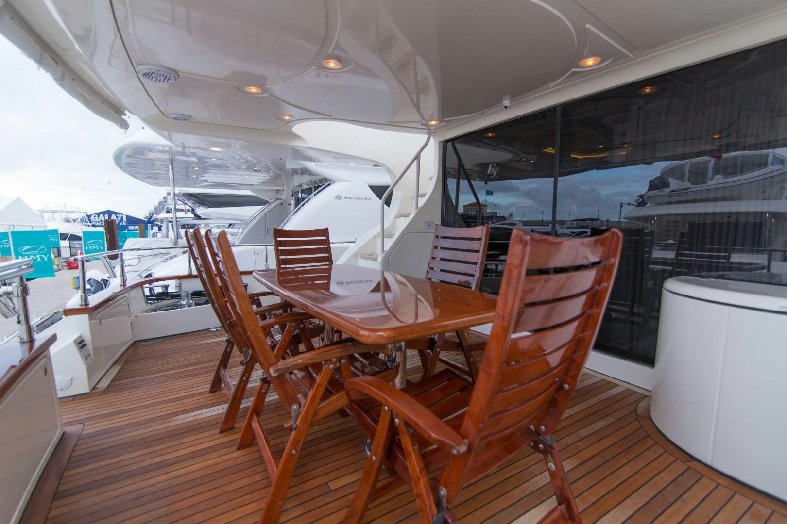 a boat with tables and chairs aboard ENCHANTED LADY Yacht for Sale