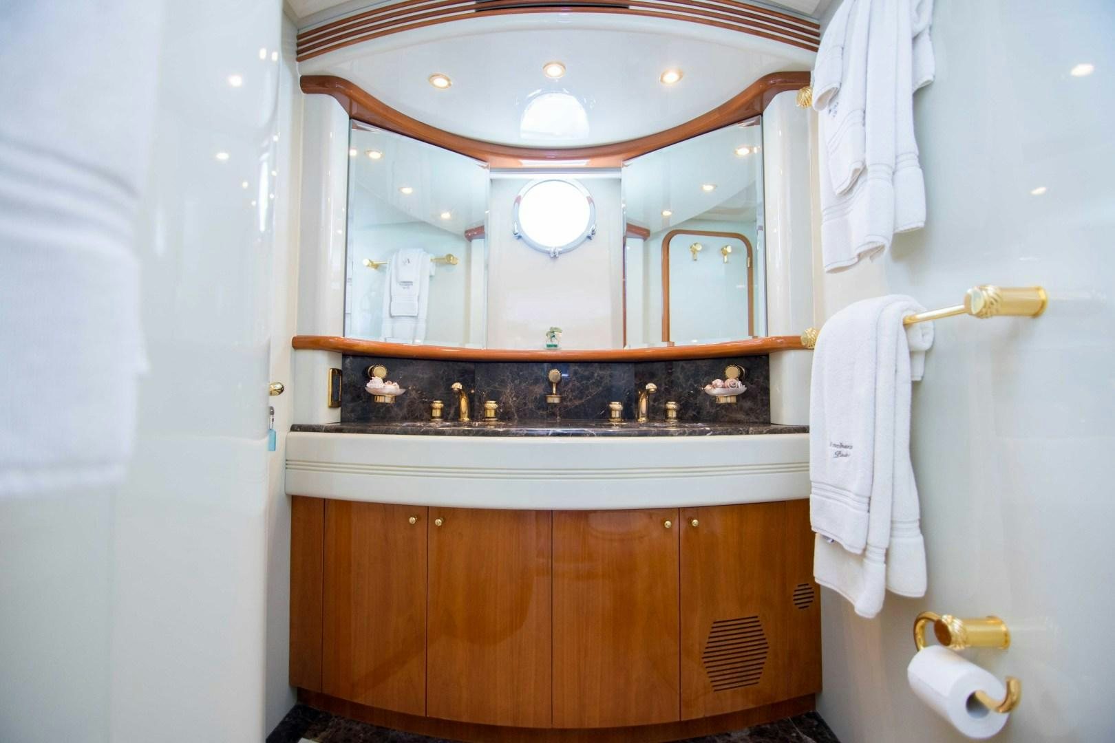 a bathroom with a large mirror aboard ENCHANTED LADY Yacht for Sale
